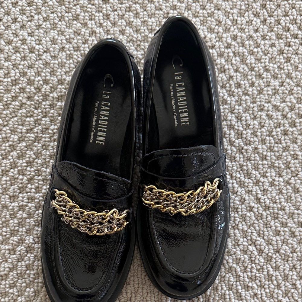 La CANADIENNE Black Patent Loafers with Gold Chain Detail